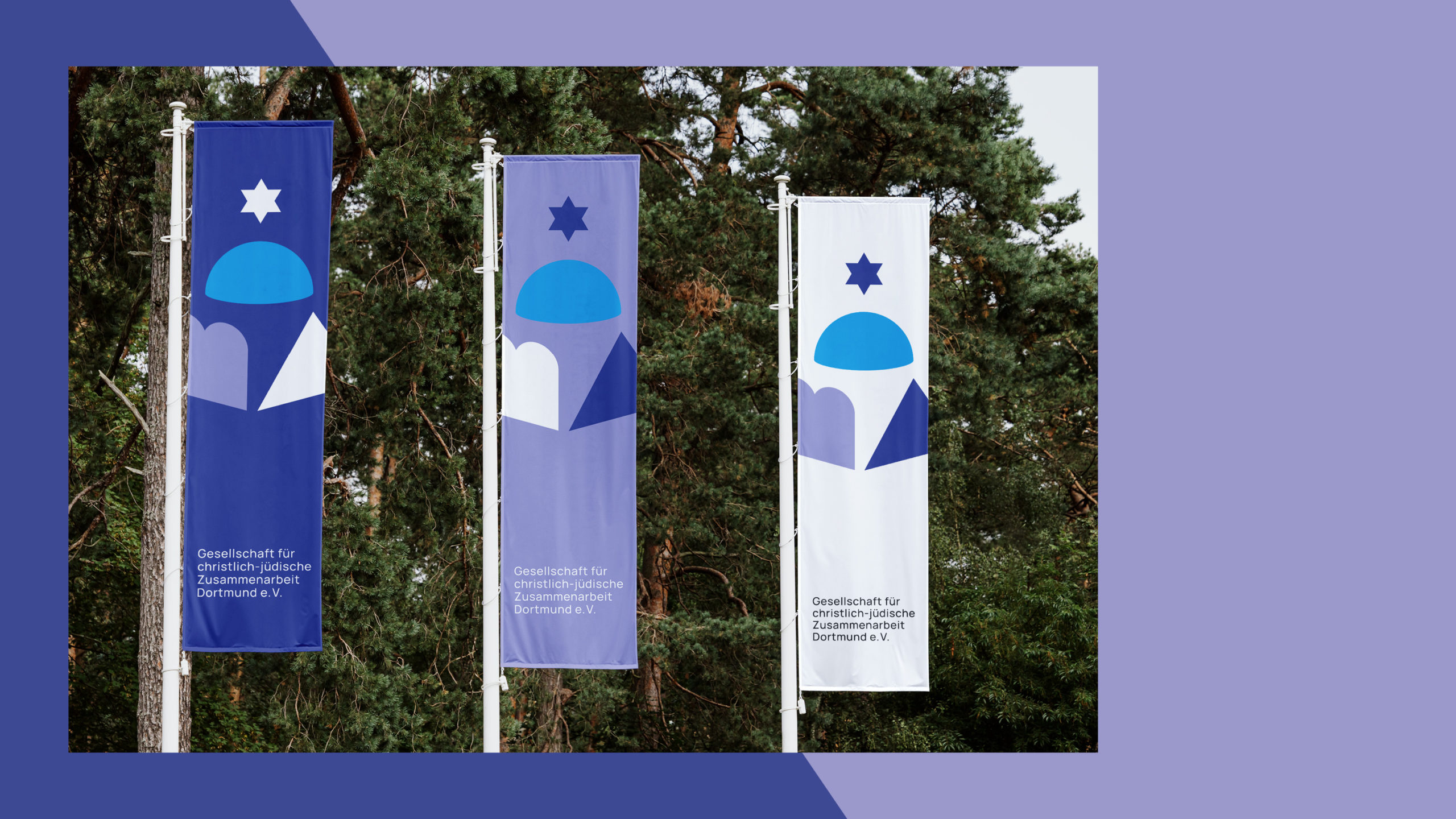 A view of three flags for the Society for Christian-Jewish Cooperation, designed by Florida Brand Design